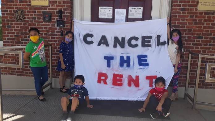 In front of CASA's Langley Park headquarters, children from the neighborhood express their views on the housing crisis. Photo courtesy of CASA