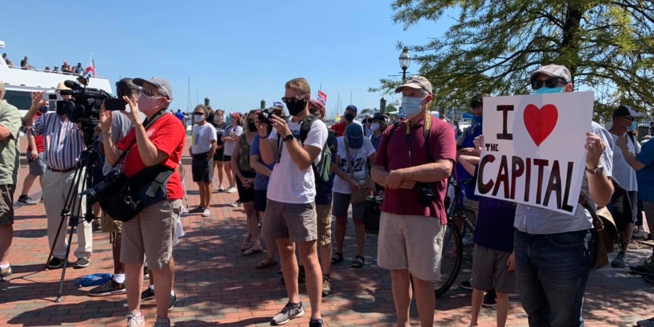 Staffers and concerned readers rallied at the Annapolis city dock Monday opposing the closing of the newsroom of the Capital Gazette. Tom Jackman of the Washington Post has the story below. Photo from Pamela Wood's Facebook page.
